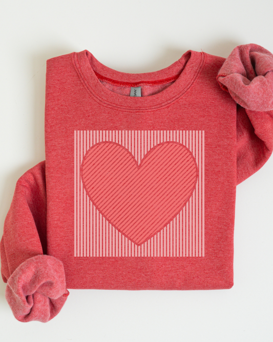 Red sweatshirt with a heart design on a white background